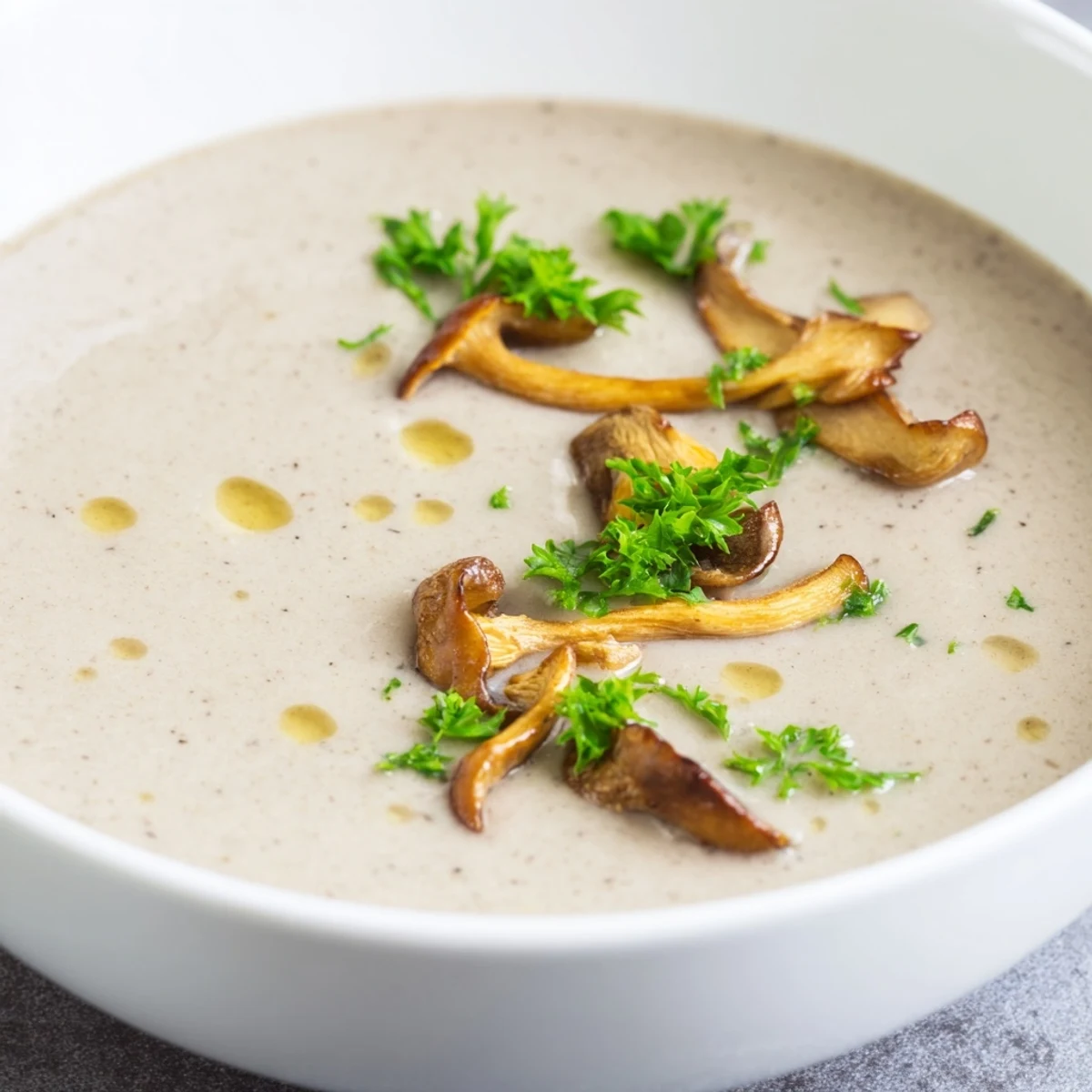 A close-up of the delicious Creamy Mushroom Bisque, steaming with a rich, savory aroma.