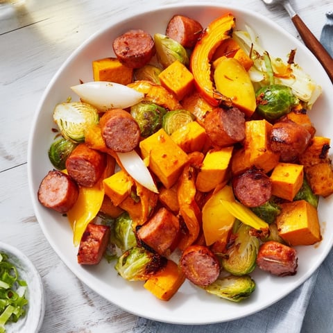 Golden-brown, roasted Hearty Sheet Pan Sausage and Autumn Veggie Medley, perfect for a flavorful weeknight meal.