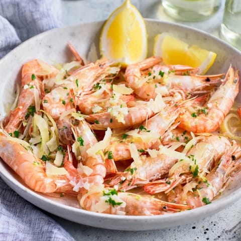Golden-brown 20-minute creamy garlic shrimp ready to serve, with fresh parsley garnish and vibrant flavors.
