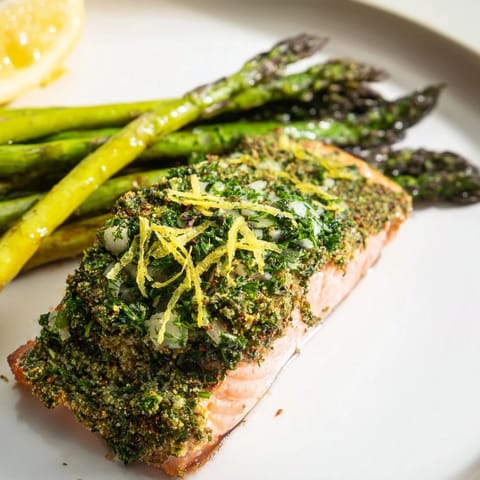 Oven-baked Easy Herb-Crusted Salmon, perfectly cooked and glistening, featuring fresh herbs and Dijon.