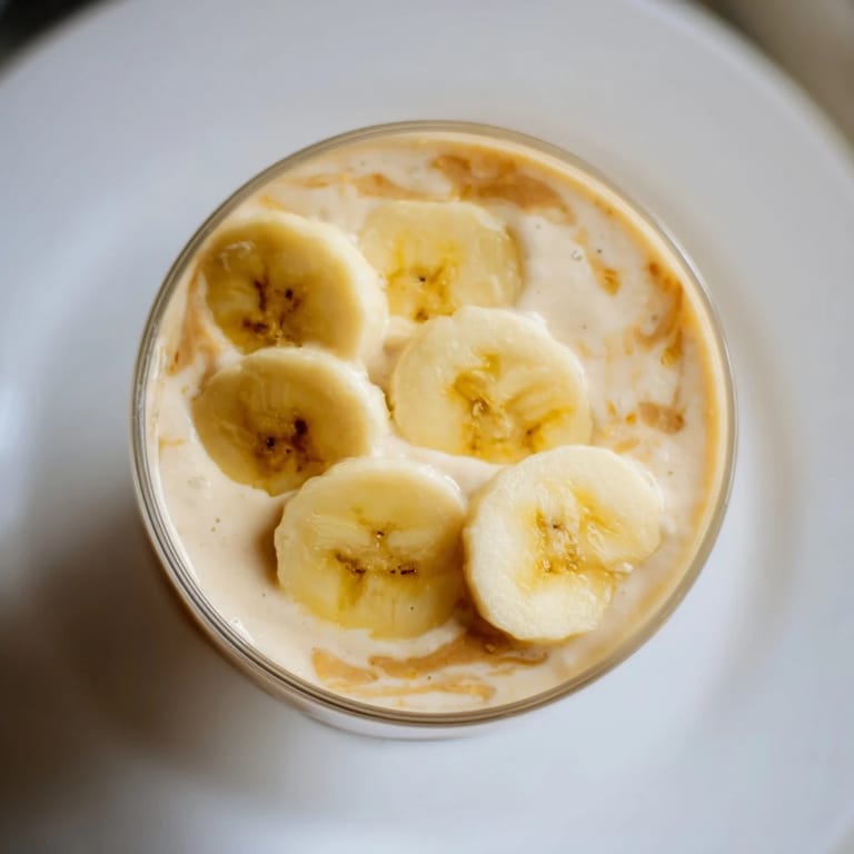 A thick and vibrant Peanut Butter Banana Smoothie, perfect for a quick and easy breakfast treat.