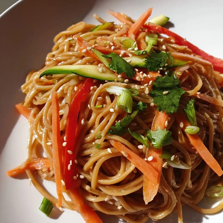 Close-up of fragrant Garlic Noodle Salad, showcasing vibrant vegetables and appealing textures.