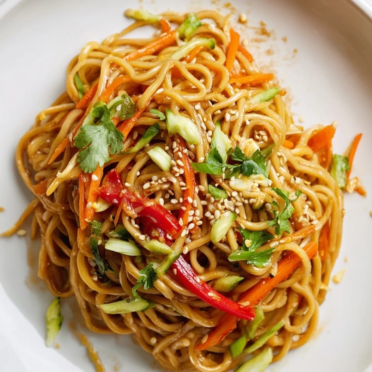 Enjoy a refreshing plate of Garlic Noodle Salad; a flavorful vegetarian meal option.