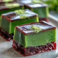 Yokan Japanese Red Bean Jelly with Matcha Layer, a vibrant dessert, beautifully swirled.